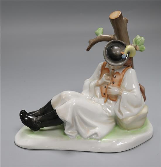 A Zsolnay ceramic model of a young piper boy by a tree height 19cm